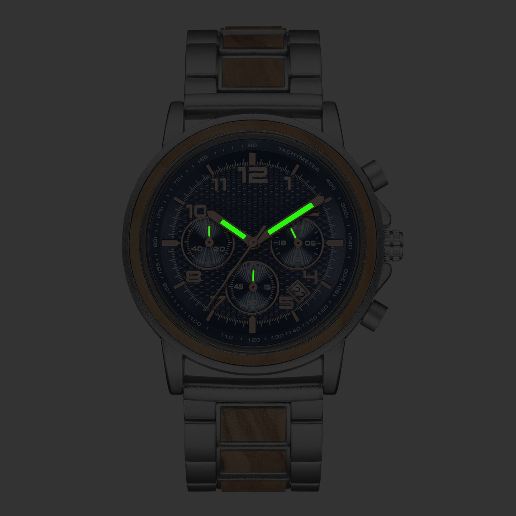 Luminous effect at dark of the silver and olive men watch