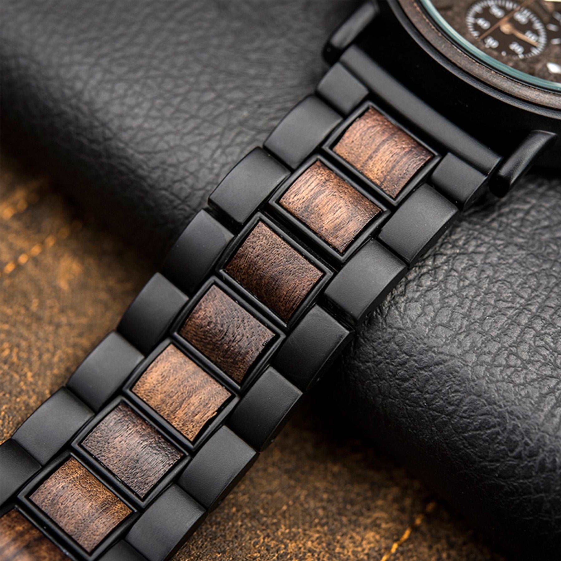 The black metal and ebony bracelet lying on the table
