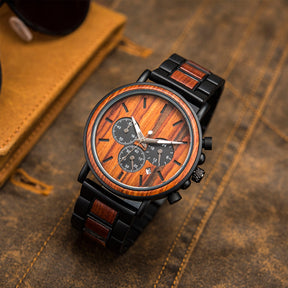 The black metal and red sandalwood men watch with red face standing on table