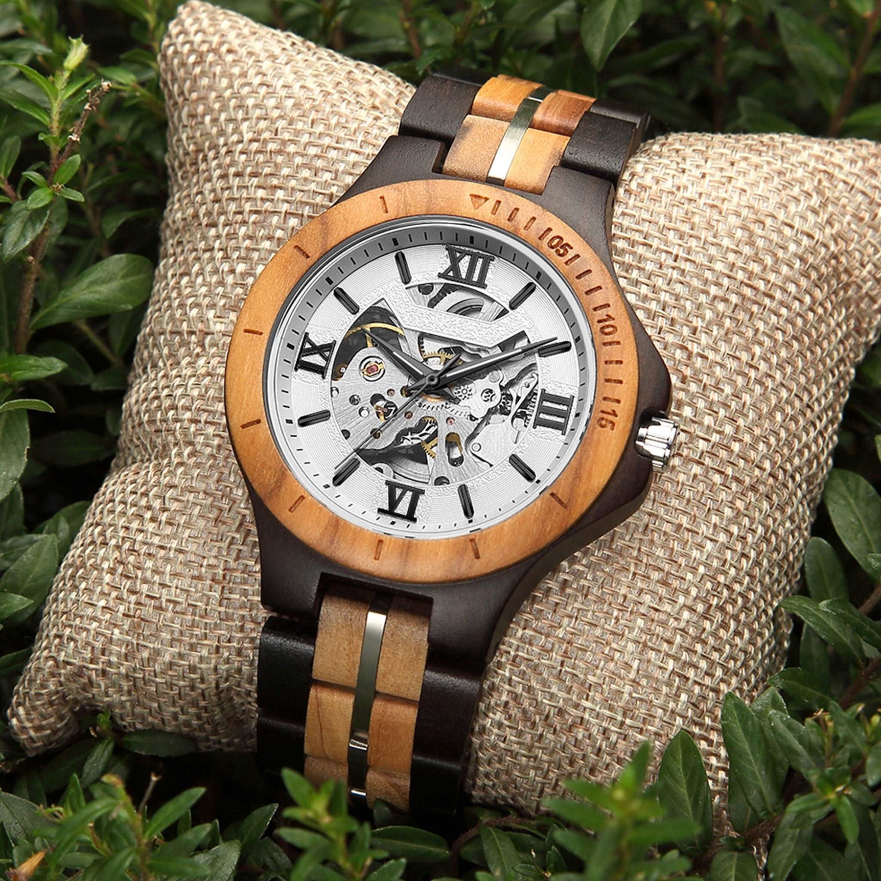 Ebony and olive automatic mechanical watch for men with white face on the plants