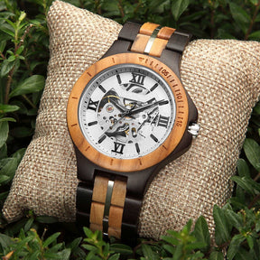 Ebony and olive automatic mechanical watch for men with white face on the plants